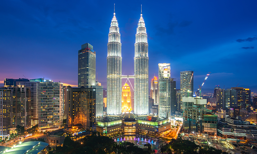 Kuala Lumpur city skyscraper and green space park with nice sky