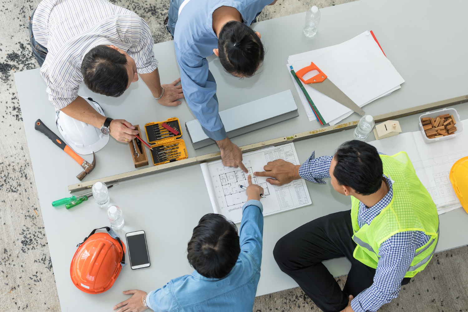 team-engineer-architects-discussing-layout-building-blueprints